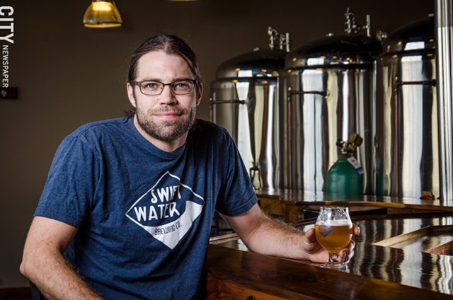 Swiftwater Brewing co-owner Andy Cook says the brewery sells most of its beer through its Mt. Hope Avenue tasting room. - PHOTO BY MARK CHAMBERLIN