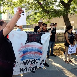 Latinos Unidos held a protest yesterday in solidarity with B.L.A.C.K. and Black Lives Matter. - PHOTO BY TIM MACALUSO