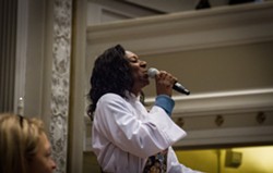 The Rev. Myra Brown sings at her ordination ceremony. - PHOTO BY KEVIN FULLER