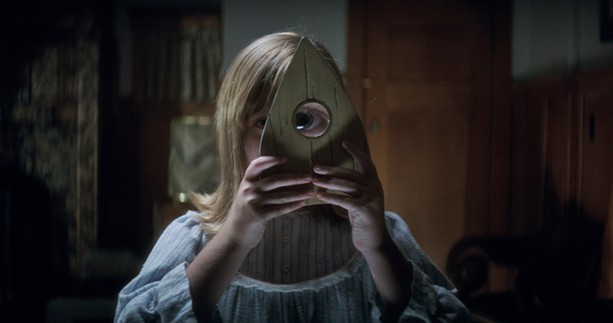 Lulu Wilson spies something sinister in "Ouija: Origin of Evil." - PHOTO COURTESY UNIVERSAL PICTURES