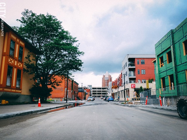 Charlotte Street, which used to be split by the Inner Loop, now connects downtown to the University-East Avenue neighborhood to the east. Above: the new Charlotte Square residential complex on the west side of the Loop infill. - PHOTO BY KEVIN FULLER