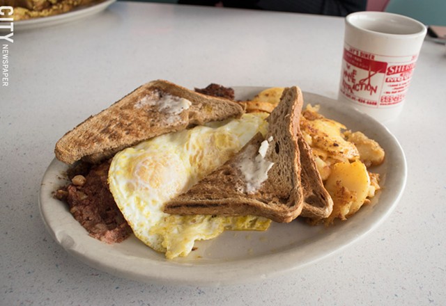 Served 24/7 at Jay's Diner: Corned beef hash with two eggs over easy, home fries, and wheat toast. - PHOTO BY JACOB WALSH