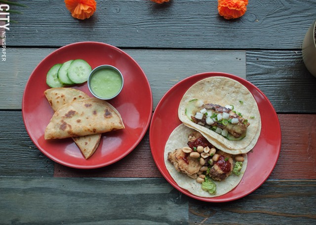 On the menu at Lulu Taqueria, from left: Smoked swordfish tacos are served with a side of salsa verde. The pork belly taco (top right) and cauliflower taco featuring avocado, peanuts, honey roja salsa (bottom right). - PHOTO BY REBECCA RAFFERTY
