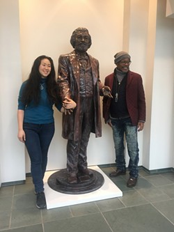 Artist Olivia Kim and Carvin Eison with one of Kim's statues of Frederick Douglass. Volunteers were an important factor in producing the sculptures. - PHOTO PROVIDED