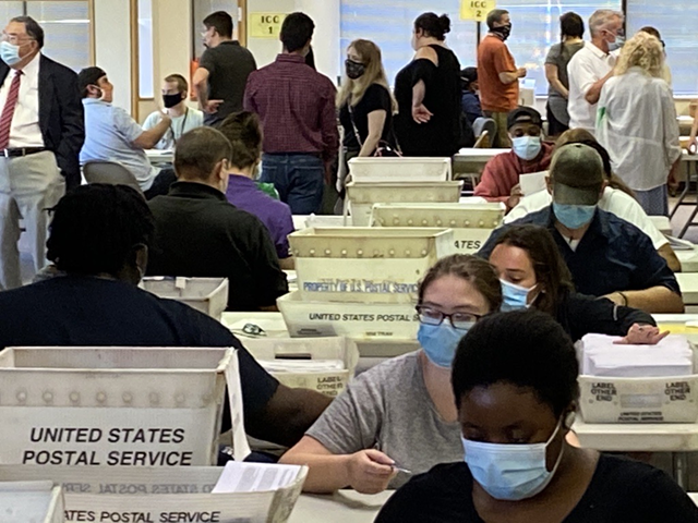 Monroe County Board of Elections workers count absentee ballots that were cast in the June 23, 2020, primary election.