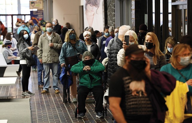 Voters waited in long lines at Perinton Square Mall to cast their ballots early.