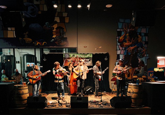 Center, singer/guitarist Ray Mahar, with fiddle player Zac Lijewski, banjoist Brad DeLano, and upright  bassist Aubrey Baldauf (all of Mahar’s band, A Girl Named Genny); mandolinist Scott Halpin of The Honey Smugglers; and guitarist Karis Gregory of Public Water Supply.