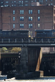 As CSX locomotive passes over High Falls in the city of Rochester. Tankers full of crude oil and liquid propane already pass through Monroe County on a regular basis and trains hauling liquefied natural gas could soon join them.