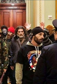 Insurrectionists stormed the Capitol on Jan. 6, 2021. Federal prosecutors say the bearded man in the center of the photo is Dominic Pezzola of Rochester.