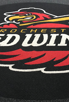 The Rochester Red Wings logo is emblazoned on the carpet of the team's clubhouse.