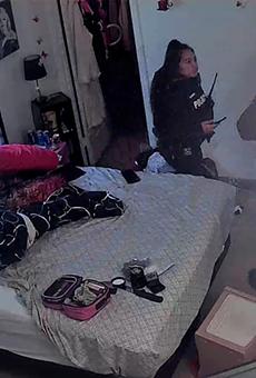 Parole Officer Doris Hernandez (left) and a second, unidentified officer, captured by Shannon Carpenter's web camera.