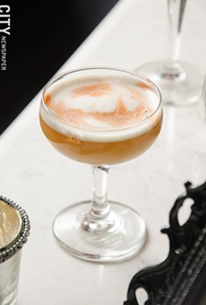 The Scofflaw is going for the authentic speakeasy tradition -- if the two red lights outside the door are lit, you know the bar is open. The establishment incorporates an Italian-influenced menu, and has curated a cocktail menu that will change every few months. The current menu features the West Egg.