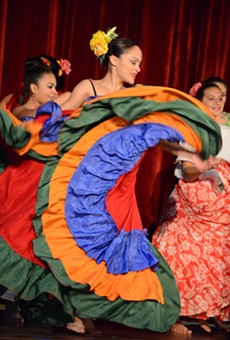 Elizabeth Díaz performs a plena -- a folkloric Puerto Rican dance -- during a Hispanic AND Latino Heritage Family Day at the Memorial Art Gallery.