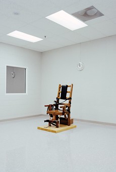 Lucinda Devlin’s photograph, “Electric Chair, Greensville Correctional Facility, Greensville, VA, 1991,” from the series “The Omega Suites,” is part of a survey of her work currently on view at Eastman Museum.