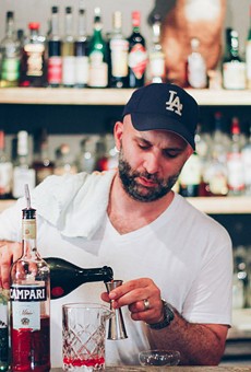 Ralph DiTucci mixes a Negroni behind the bar at Nagle's Observance. DiTucci, the bar's program director, and Eric Nagle, the owner, opened Nagle's Observance in Midtown last month.