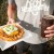 A pretty solid pairing: Roc Brewing's dark mild ale with a Roc tot waffle, with meat hot sauce, cheddar cheese, sour cream, and scallions.