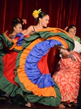 PHOTO BY PECK F. ROARD - Elizabeth Díaz performs a plena -- a folkloric Puerto Rican dance -- during a Hispanic AND Latino Heritage Family Day at the Memorial Art Gallery.
