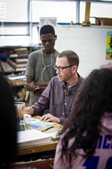 PHOTO BY KEVIN FULLER - Art teacher Geoff Morgan works with students at East High.