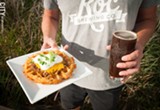PHOTO BY RYAN WILLIAMSON - A pretty solid pairing: Roc Brewing's dark mild ale with a Roc tot waffle, with meat hot sauce, cheddar cheese, sour cream, and scallions.