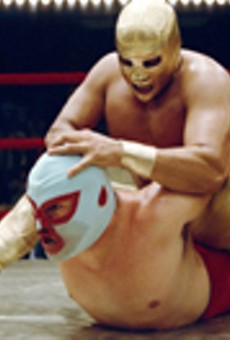 Who is that
    masked man? Jack Black (bottom) takes on other luchadors
    in the new film "Nacho Libre."