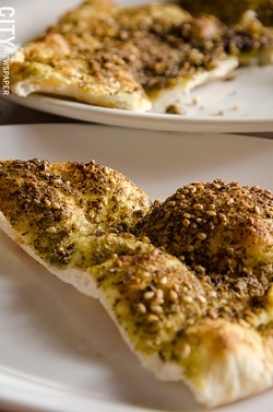 Za'atar Manakeesh (flatbread with thyme, sumac, and olive oil) - PHOTO BY MARK CHAMBERLIN